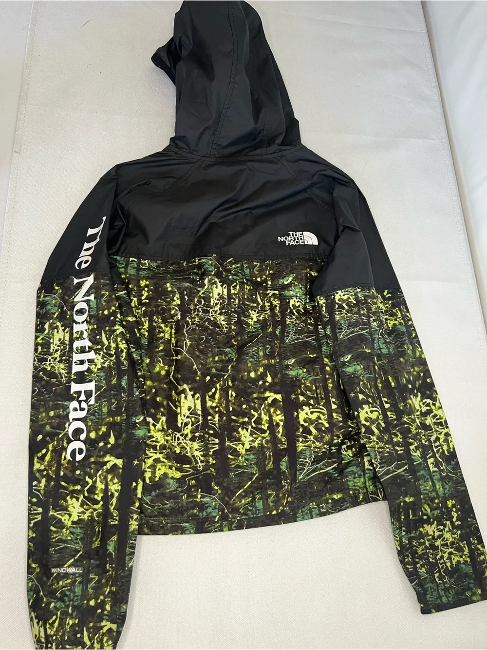 The North Face Kids Black Hooded Rain Jacket with Neon Green Print